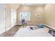 This exercise room features natural light, wood flooring, and fitness equipment including a BOSU ball and yoga mat at 6005 Carlyle Dr, Raleigh, NC 27614