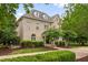 A beautifully landscaped brick home with a well-maintained lawn and a charming, inviting exterior, perfect for Gathering living at 6005 Carlyle Dr, Raleigh, NC 27614