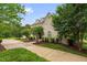 Beautiful brick home with manicured landscaping and mature trees, creating a picturesque setting for comfortable living at 6005 Carlyle Dr, Raleigh, NC 27614