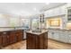 Spacious kitchen with granite counters, stainless appliances, and wood-trimmed island at 6005 Carlyle Dr, Raleigh, NC 27614