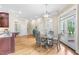 Open concept floorplan with kitchen island that flows into a dining area and stairs at 6005 Carlyle Dr, Raleigh, NC 27614