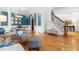 Bright open-concept living room with hardwood floors and staircase view to the second floor at 6005 Carlyle Dr, Raleigh, NC 27614