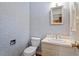 Powder room with a standard toilet, vanity and mirror at 604 Eden Ln, Chapel Hill, NC 27517