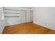 Bedroom with built in shelving, hardwood floors, and natural light at 604 Eden Ln, Chapel Hill, NC 27517