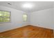 Bedroom featuring hardwood floors, a window, and ample natural light at 604 Eden Ln, Chapel Hill, NC 27517