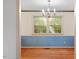 Dining room with hardwood floors and traditional chandelier at 604 Eden Ln, Chapel Hill, NC 27517