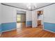 Dining room with hardwood floors, wainscotting, and natural light at 604 Eden Ln, Chapel Hill, NC 27517