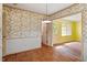 Dining room featuring brick floors and classic wallpaper at 604 Eden Ln, Chapel Hill, NC 27517