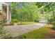 Long driveway with parking, basketball hoop, and lush, mature landscaping at 604 Eden Ln, Chapel Hill, NC 27517
