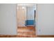 Hallway with wood floors, blue trim, and neutral wall colors at 604 Eden Ln, Chapel Hill, NC 27517