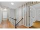 Upstairs hallway featuring hardwood floors and striped wallpaper at 604 Eden Ln, Chapel Hill, NC 27517