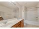 Spacious bathroom featuring a double sink vanity and a shower-tub combination at 615 Carlton Commons Ln, Cary, NC 27519