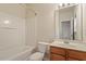 Bathroom featuring a tub and shower combination, a toilet, and a wooden vanity at 615 Carlton Commons Ln, Cary, NC 27519