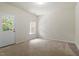 Spacious bedroom featuring neutral carpet, natural light, and a doorway to the outdoors at 615 Carlton Commons Ln, Cary, NC 27519