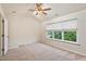 Cozy bedroom with a ceiling fan and large windows providing natural light at 615 Carlton Commons Ln, Cary, NC 27519