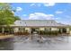 The well-maintained community clubhouse boasts a charming exterior, inviting residents to gather and enjoy shared amenities at 615 Carlton Commons Ln, Cary, NC 27519