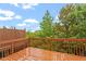 Wood deck offers an outdoor space with views of lush trees and blue skies at 615 Carlton Commons Ln, Cary, NC 27519