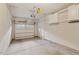 Spacious garage with a garage door, concrete floor, and a door to go inside the house at 615 Carlton Commons Ln, Cary, NC 27519