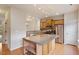 Well-lit kitchen with a center island, stainless steel appliances, and ample cabinet space, ideal for culinary enthusiasts at 615 Carlton Commons Ln, Cary, NC 27519