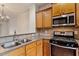 Efficient kitchen with stainless appliances, double sink, and ample cabinetry, perfect for cooking and meal preparation with ease at 615 Carlton Commons Ln, Cary, NC 27519