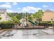 Community playground with slides and climbing structures provides recreation space for residents in a well-maintained neighborhood at 615 Carlton Commons Ln, Cary, NC 27519