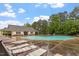 Relax by the inviting community pool, a perfect spot for relaxation, complemented by lush landscaping and ample seating options at 615 Carlton Commons Ln, Cary, NC 27519