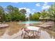 The sparkling community pool is surrounded by comfortable seating and lush landscaping, creating a serene oasis for residents at 615 Carlton Commons Ln, Cary, NC 27519