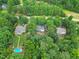 Aerial view of a home and surrounding mature trees, creating a serene and private setting at 618 Durwood Dr, Raleigh, NC 27603