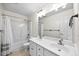 Bright bathroom featuring a double vanity, large mirror and shower-tub combination at 618 Durwood Dr, Raleigh, NC 27603
