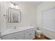 Clean bathroom featuring single vanity, large mirror, and toilet at 618 Durwood Dr, Raleigh, NC 27603