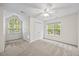 Lovely bedroom with large windows that bring in natural light and feature a ceiling fan at 618 Durwood Dr, Raleigh, NC 27603