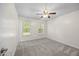 Bedroom with neutral carpet and a ceiling fan at 618 Durwood Dr, Raleigh, NC 27603