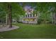 Charming two-story home featuring a welcoming front porch and well-maintained landscaping at 618 Durwood Dr, Raleigh, NC 27603