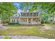 Charming two-story home featuring a welcoming front porch and well-maintained landscaping at 618 Durwood Dr, Raleigh, NC 27603