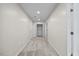 Spacious hallway featuring recessed lighting, neutral walls, and plush carpet at 618 Durwood Dr, Raleigh, NC 27603