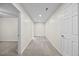 Finished hallway with neutral paint, recessed lighting, and access to rooms at 618 Durwood Dr, Raleigh, NC 27603