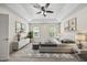 Bright and airy main bedroom with tray ceiling, ceiling fan, and neutral decor at 618 Durwood Dr, Raleigh, NC 27603