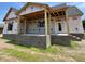 Exterior of home with brick foundation and framed porch area at 6332 River Rd, Fuquay Varina, NC 27526