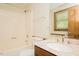 Bathroom with a marble vanity, and a shower-tub combo with tile surround at 7030 Stockard Rd, Snow Camp, NC 27349