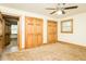 Bedroom with two windows and two closets and view to the next room at 7030 Stockard Rd, Snow Camp, NC 27349