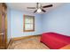 Cozy bedroom with natural light, neutral paint, and a ceiling fan for added comfort at 7030 Stockard Rd, Snow Camp, NC 27349