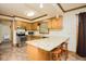 Bright kitchen features granite countertops, updated appliances, and a view of the outdoor deck at 7030 Stockard Rd, Snow Camp, NC 27349