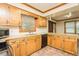 Open kitchen with stainless steel appliances, granite countertops, and natural light at 7030 Stockard Rd, Snow Camp, NC 27349