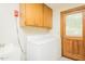 Functional laundry room with washer, dryer, utility sink, and exterior access at 7030 Stockard Rd, Snow Camp, NC 27349