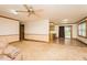 Open-concept living area with view to a kitchen and patio, offering modern living at 7030 Stockard Rd, Snow Camp, NC 27349