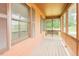 Inviting screened porch featuring a swing, offering relaxation with views of the lush outdoor area at 7030 Stockard Rd, Snow Camp, NC 27349