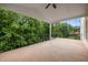 Spacious back deck with ceiling fan, offering outdoor living with wooded views at 7409 Chesley Ln, Durham, NC 27713