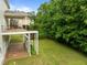 Elevated backyard deck, perfect for entertaining and relaxing with an entrance to a brick patio and large lawn at 7409 Chesley Ln, Durham, NC 27713