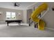 Spacious game room featuring a pool table, tube slide, carpeted floors and lots of room at 7409 Chesley Ln, Durham, NC 27713