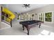 Large game room featuring a pool table, tube slide, and lots of natural light at 7409 Chesley Ln, Durham, NC 27713